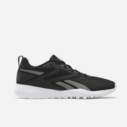 Reebok Flexagon Energy TR 4 Chaussures De Running en noir avec semelle blanche, conçues pour confort et performance.