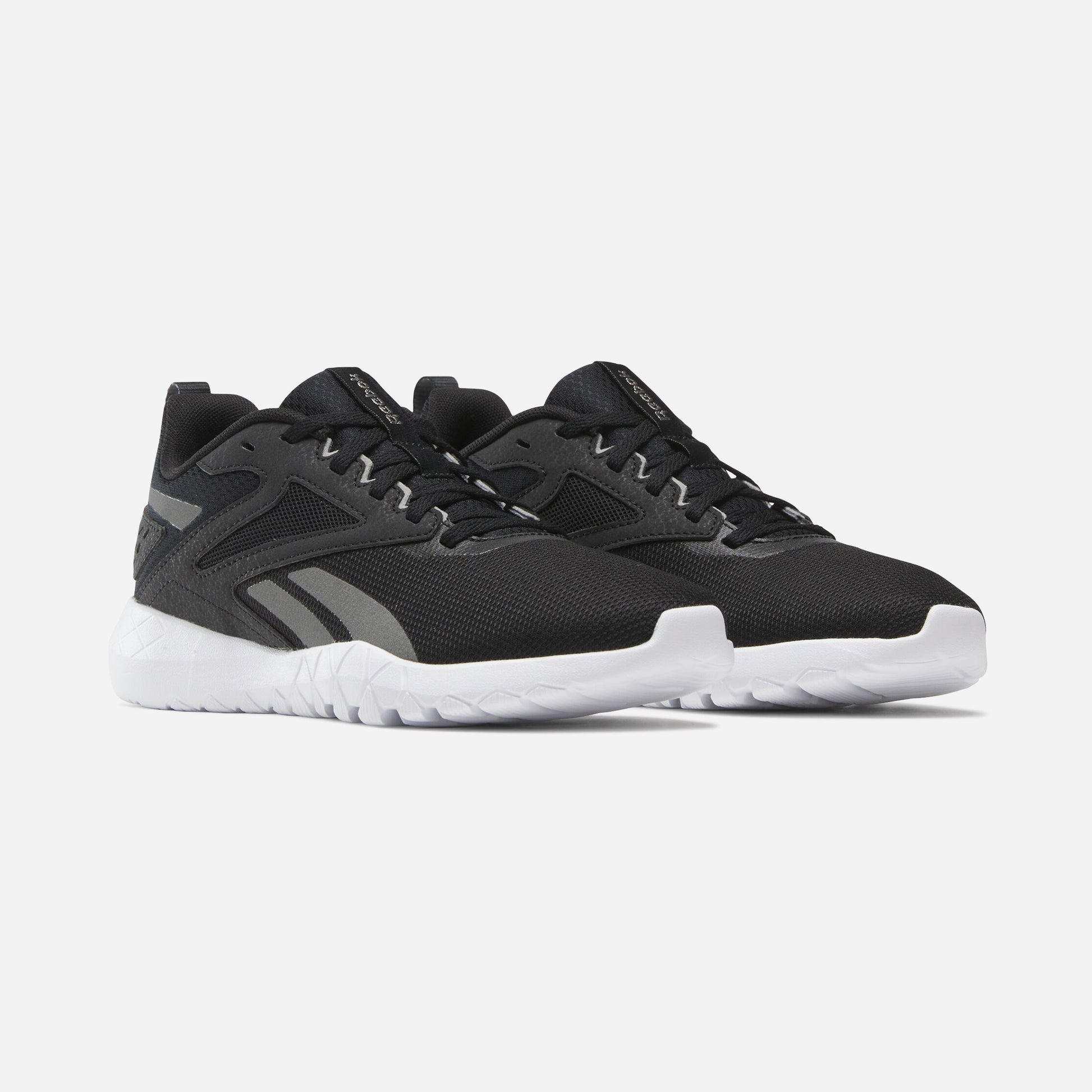 Reebok Flexagon Energy TR 4 Chaussures De Running en noir, offrant confort et performance pour vos entraînements.