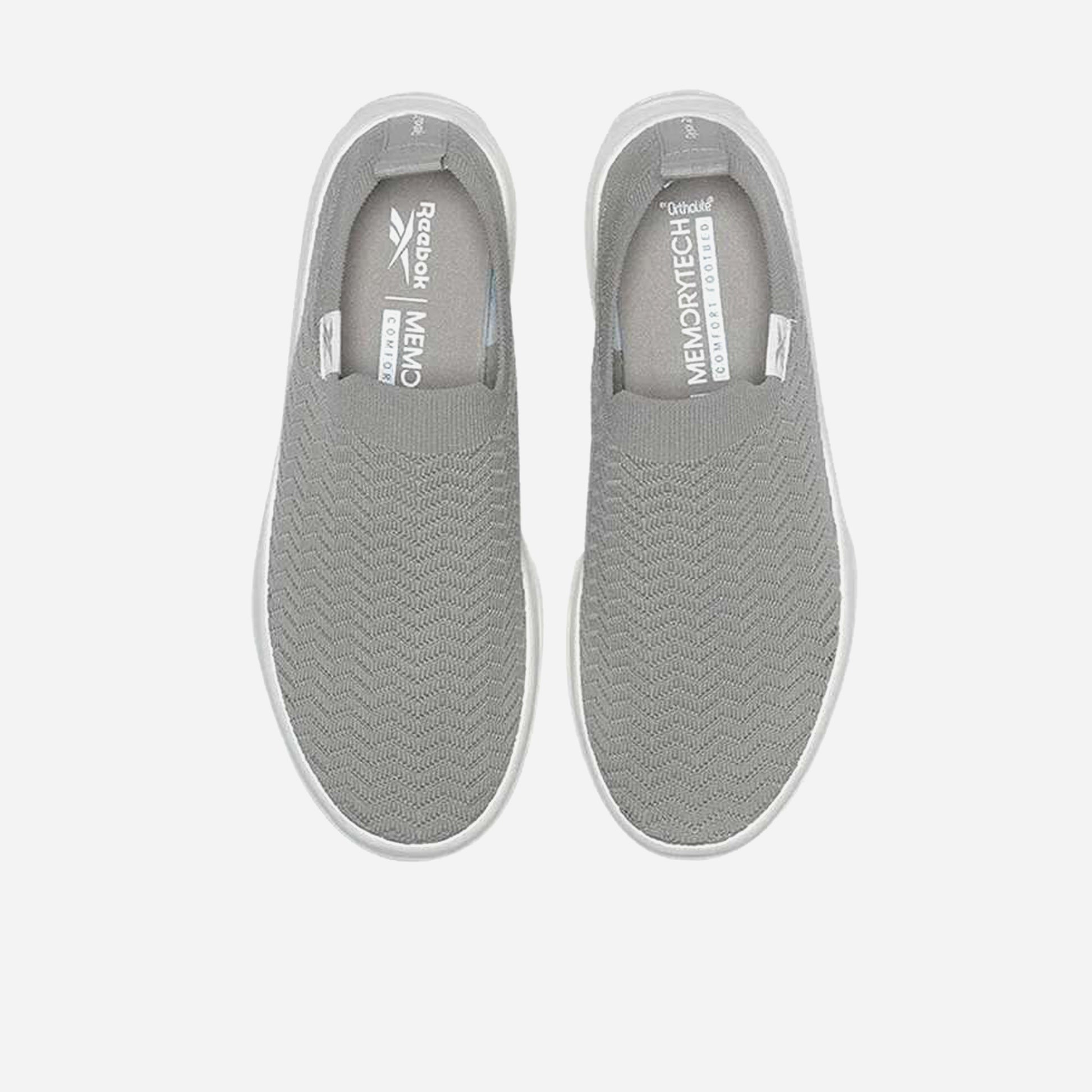 Reebok Onlux Chaussures Sans Lacets en gris, conçues pour le confort et le style moderne.