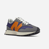 New Balance 327 women's sneakers in gray, purple, and orange, inspired by 70s running shoes and modern aesthetics.