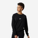 Black New Balance Essentials Crew T-shirt worn by a woman, showcasing casual style and comfort.