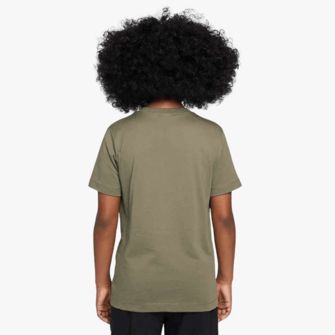 Back view of a kid wearing Nike Sportswear Graphic T-Shirts in olive green, showcasing its classic fit and comfort.